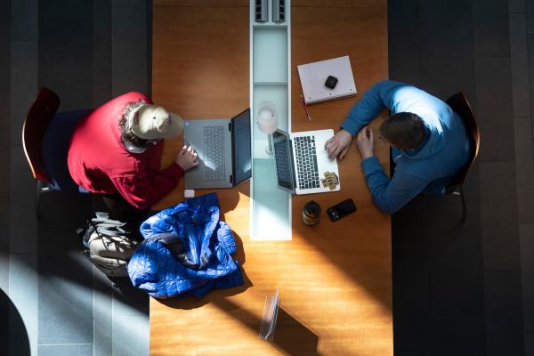 Overhead view of two students studying