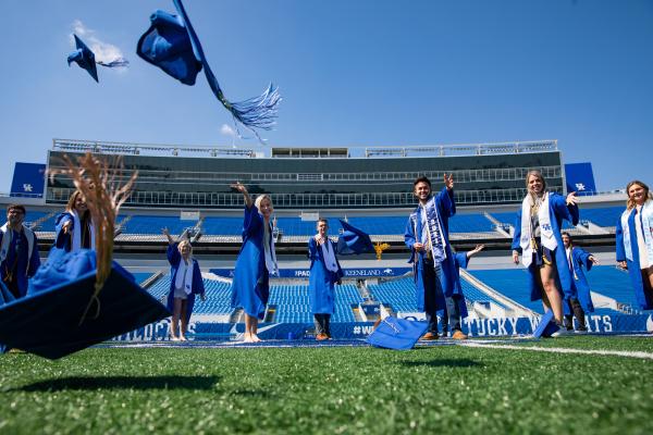 Grads throwing hats