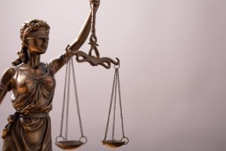 Decorative image of the scales of justice