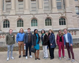 Group of students posing in front of Kentucky capitol building