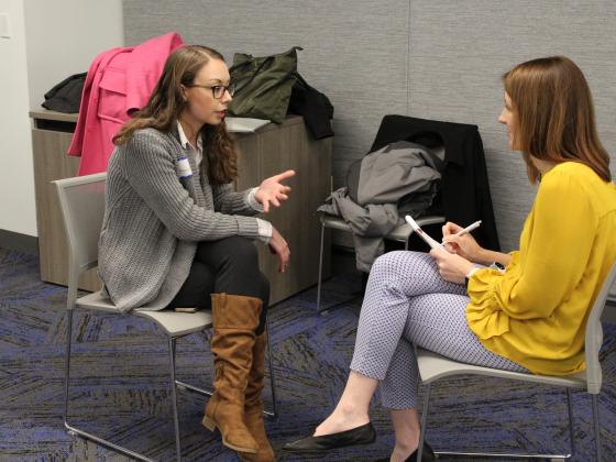 Two students discussing their capstone projects