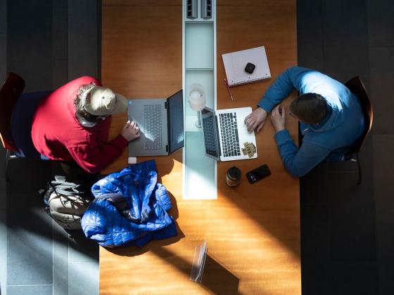 Overhead view of two students studying