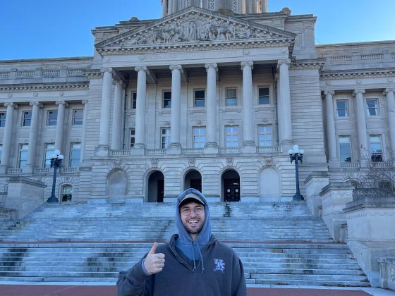 Public policy student in front of Kentucky Capitol building